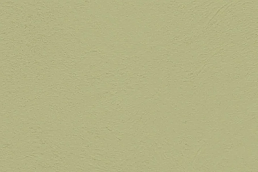 Close-up of a textured light yellow wall.