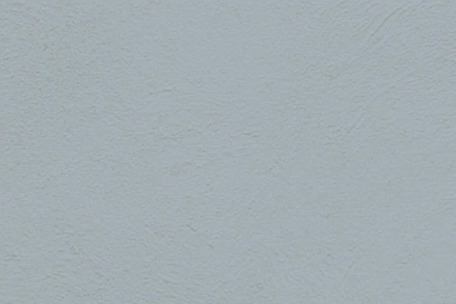 Close-up of a textured white ceiling.
