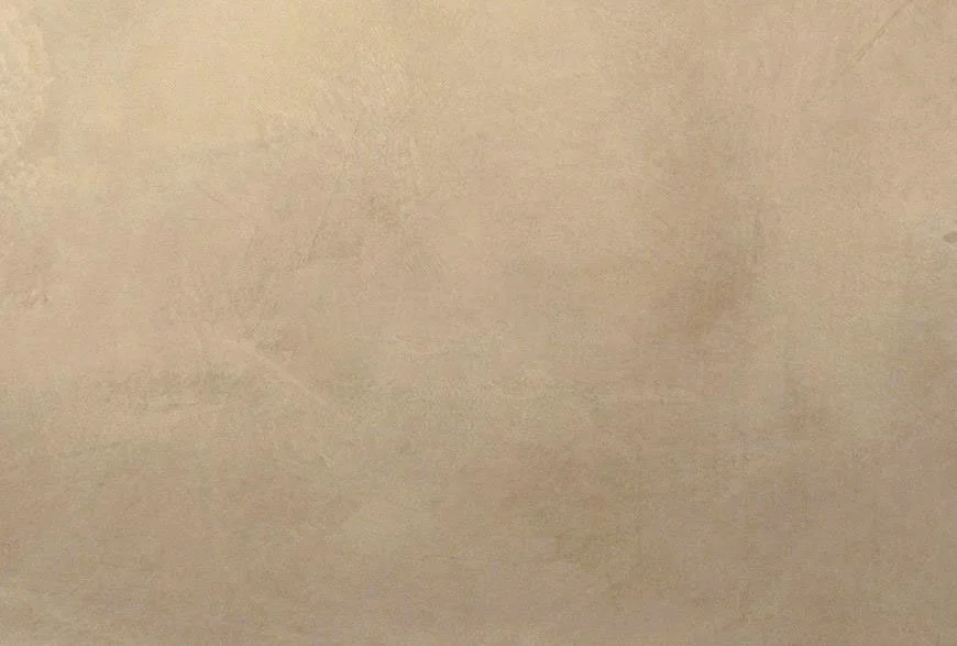 Close-up of a beige or light tan wall surface with slight texture.