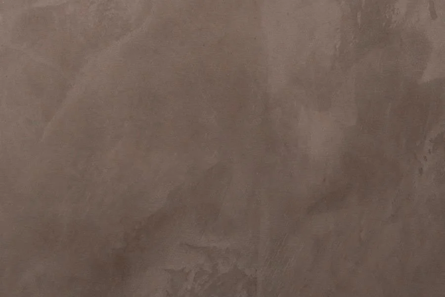 Close-up of a brown textured surface, possibly a wall or floor.