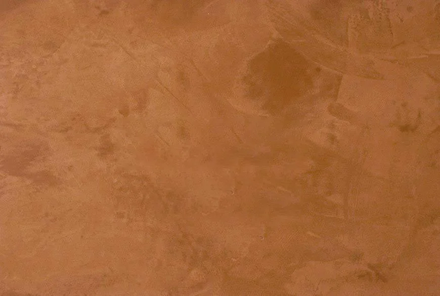 A close-up of a wooden surface, showing a smooth texture and natural wood grain pattern.