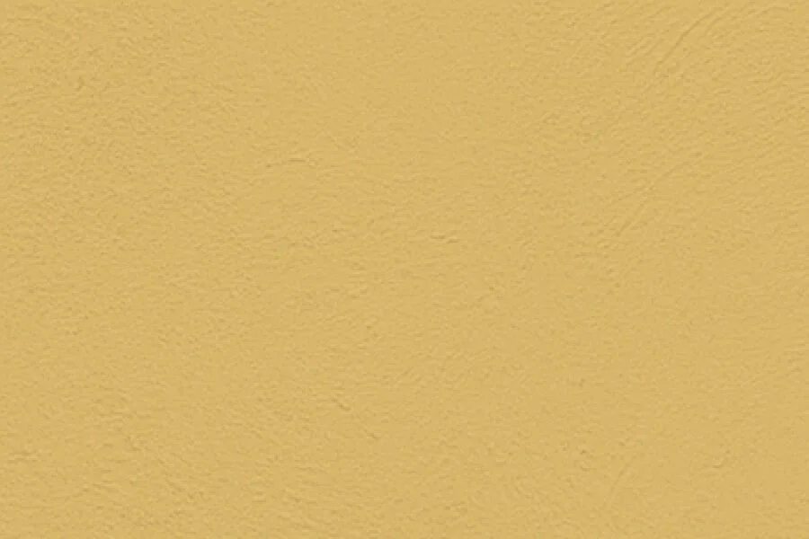 Close-up of a yellow textured wall