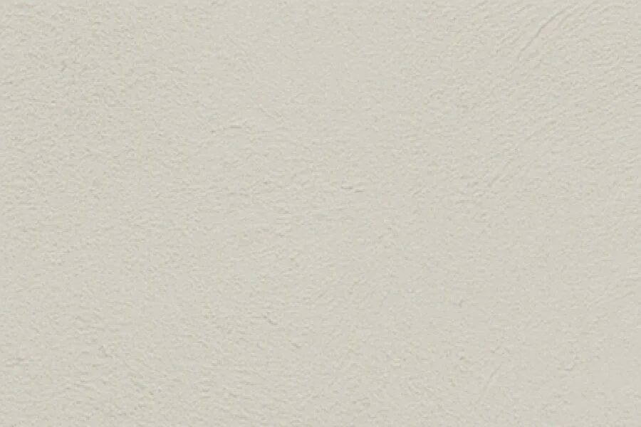 Close-up of a beige textured wall.