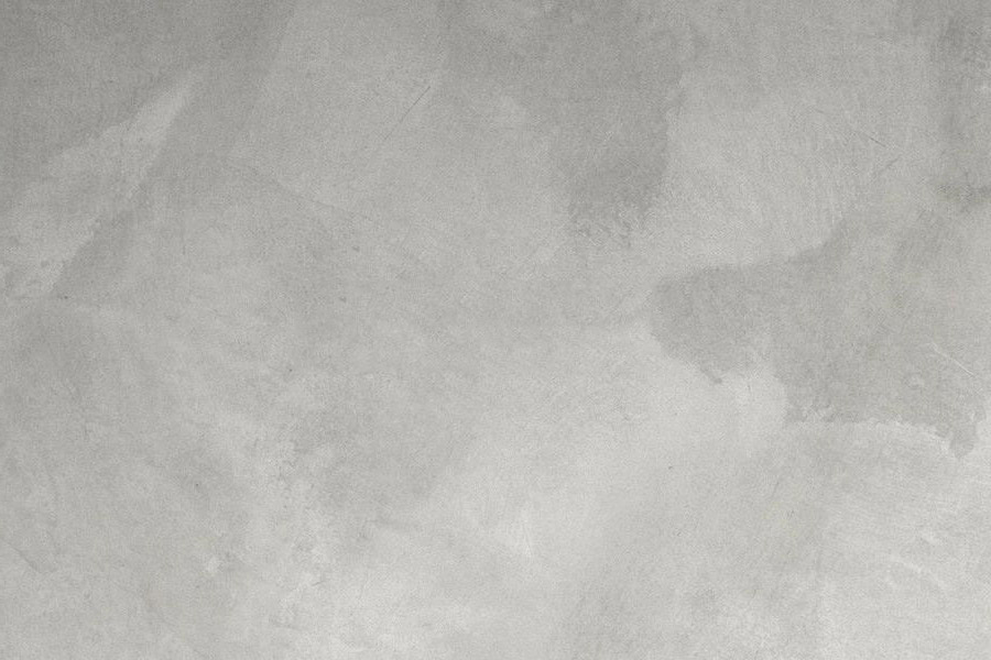 Gray textured surface with irregular patterns.