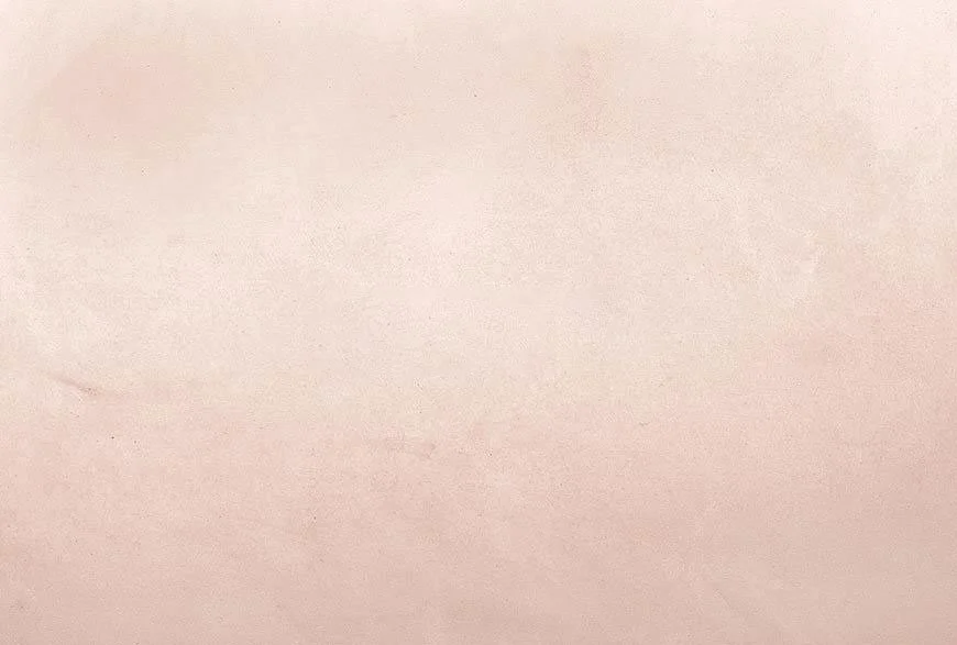 Plain, light pink surface with a smooth texture.