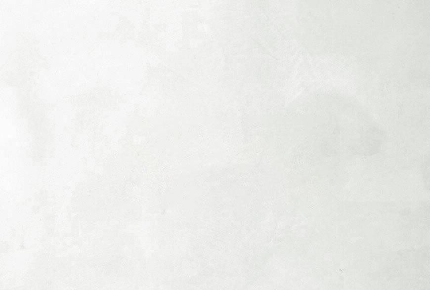 Plain white wall or surface with slight texture.