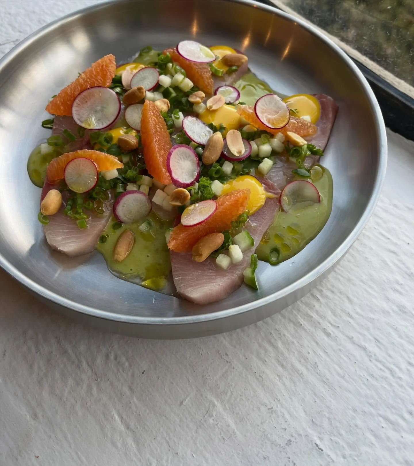 Hamachi tiradito: cara cara aquachile, peanut, aji amarillo 

on tonight