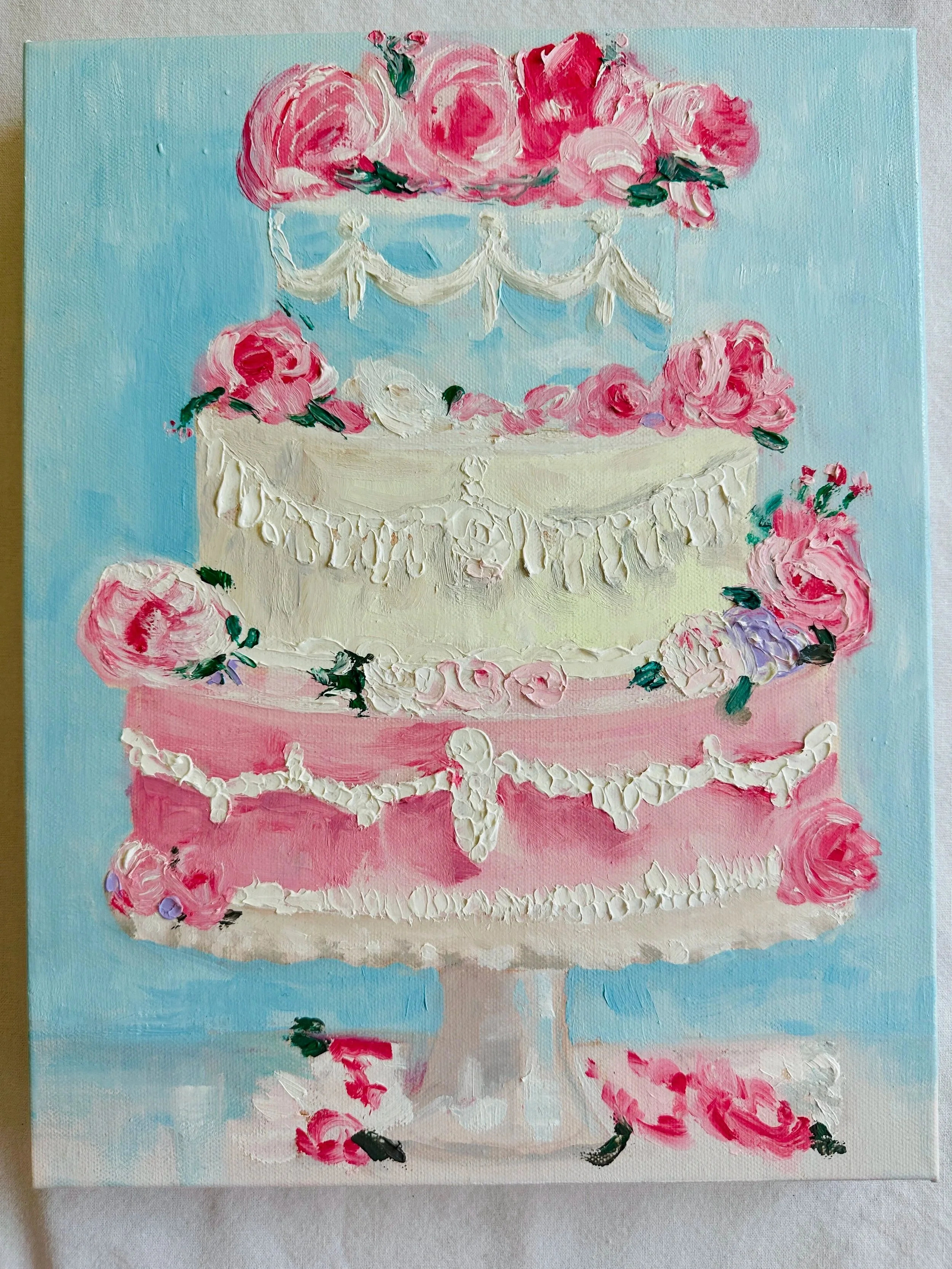 A three-tiered cake oil painting by Lisaelle decorated with pink and white roses, green leaves, and white icing garlands, set against a light blue background.