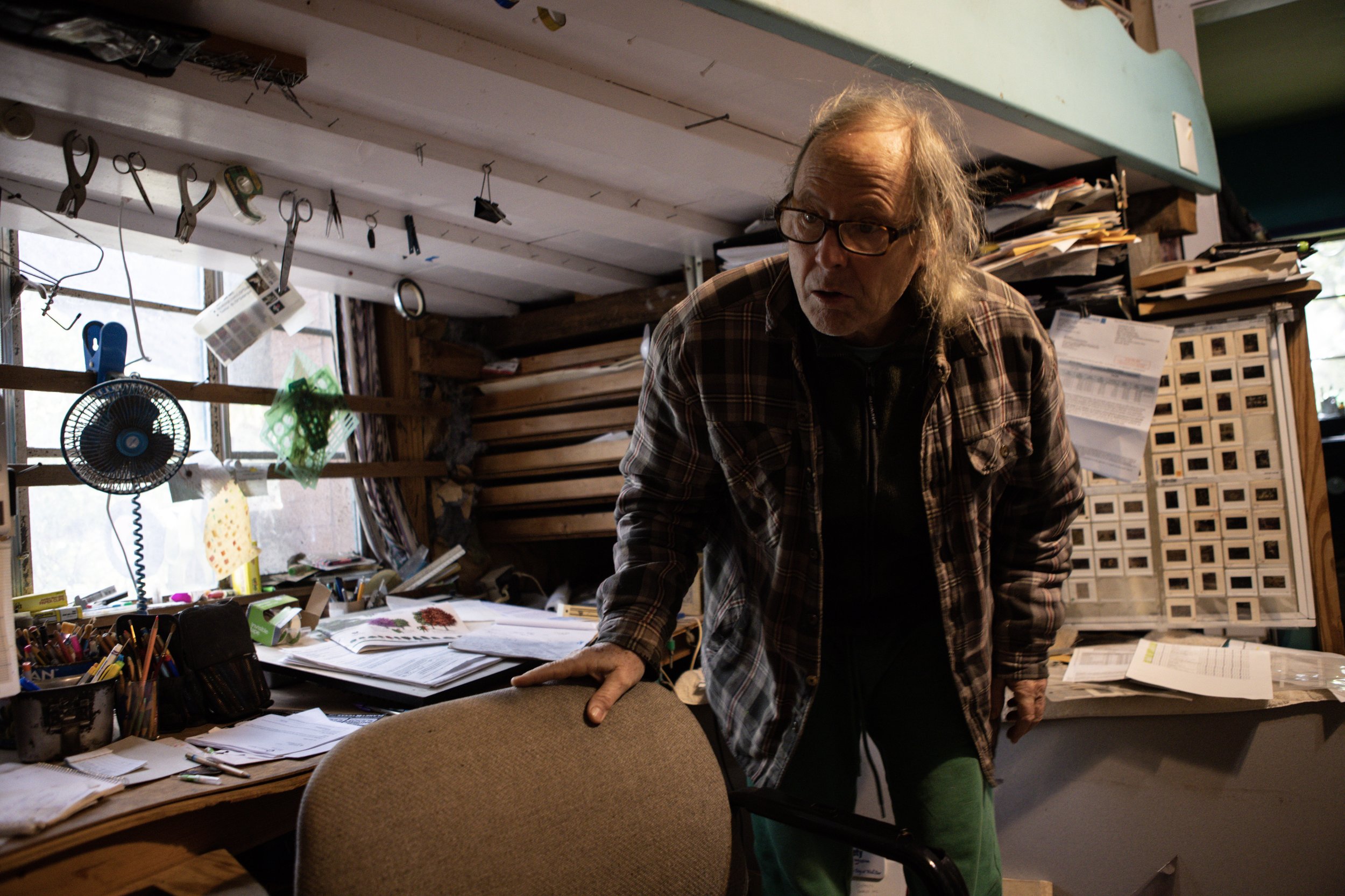 Talbot in his bedroom and office, two rooms original to his house built in 1906. “This was the original bedroom, that for 17 years, I slept in this loft,” Talbot said.