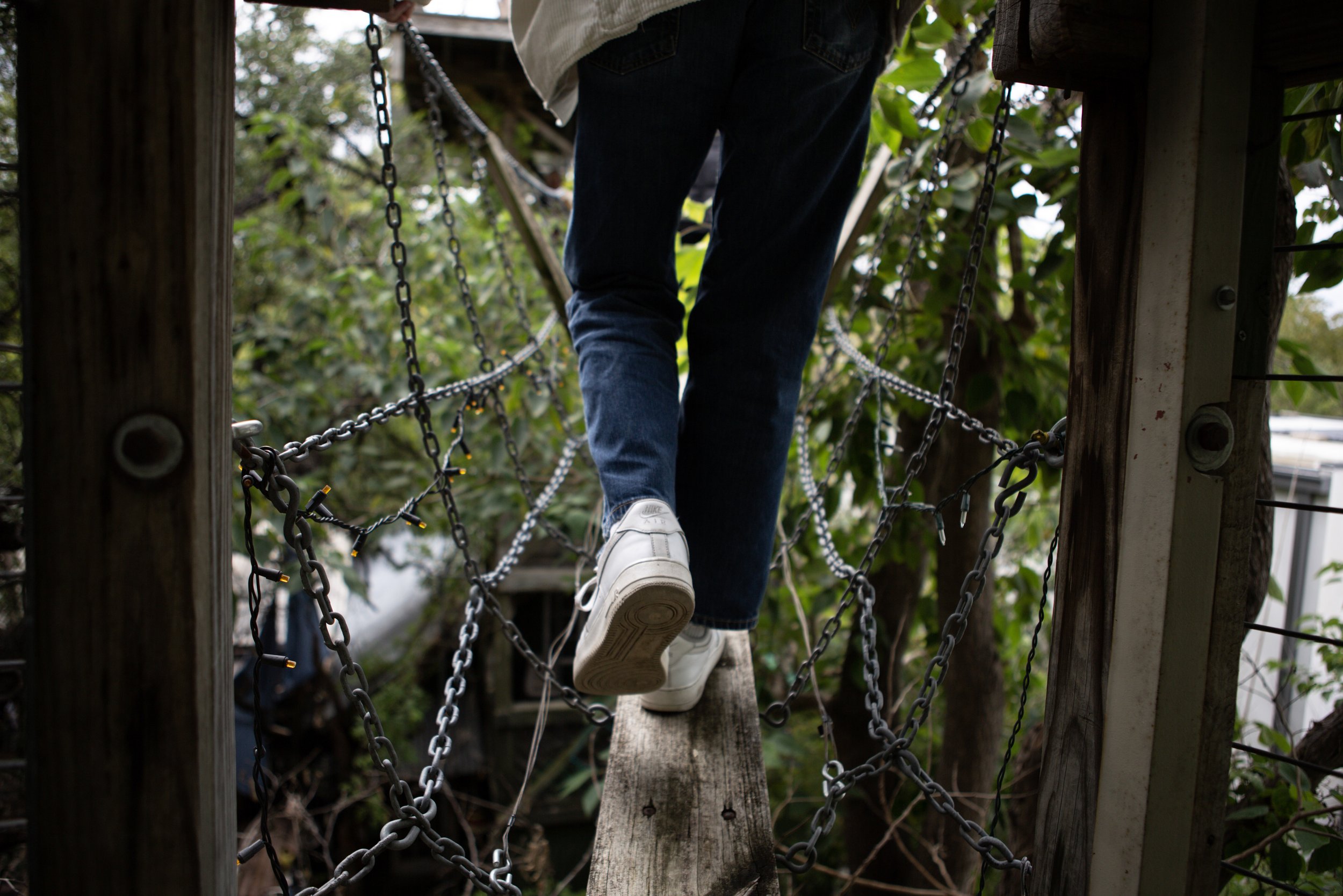 An attendee walks across the bridge on a tour of the house on Nov. 20, 2022.