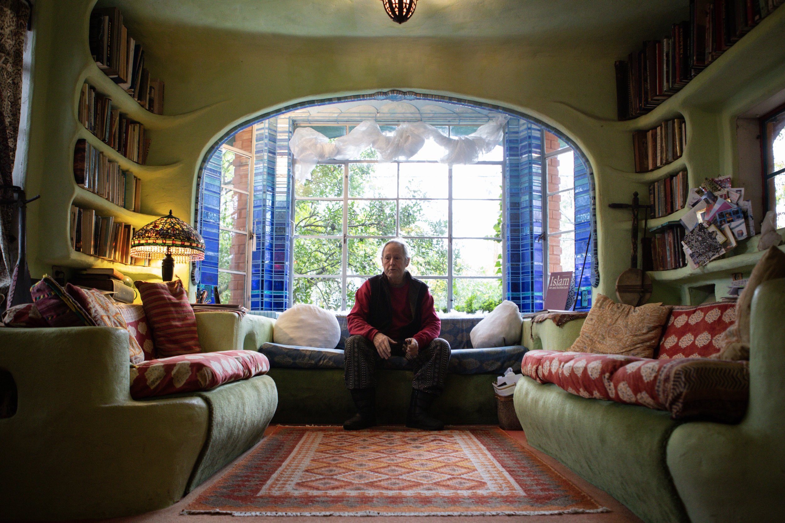 Talbot in his living room. His home has become a sanctuary for artists, locals and tourists alike.