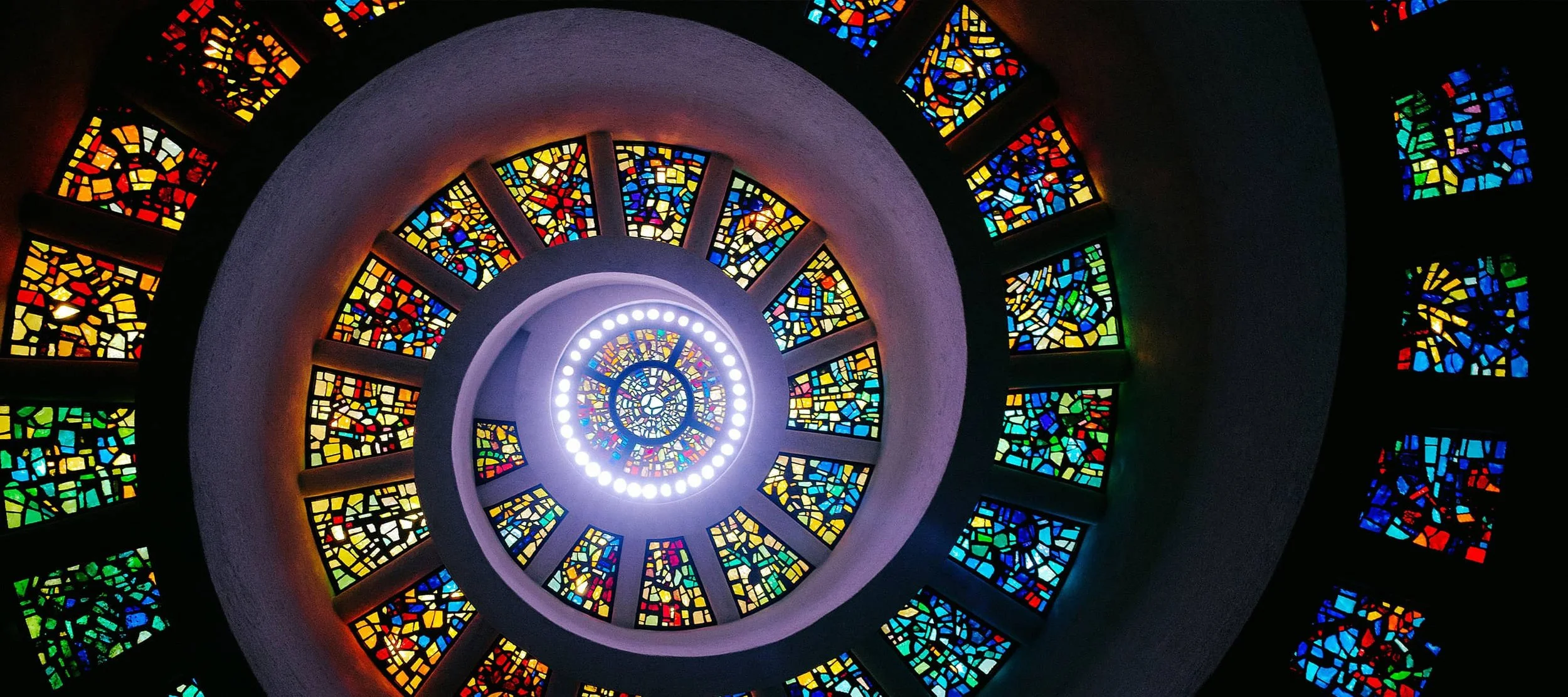 Stained glass spiral leading a bright center
