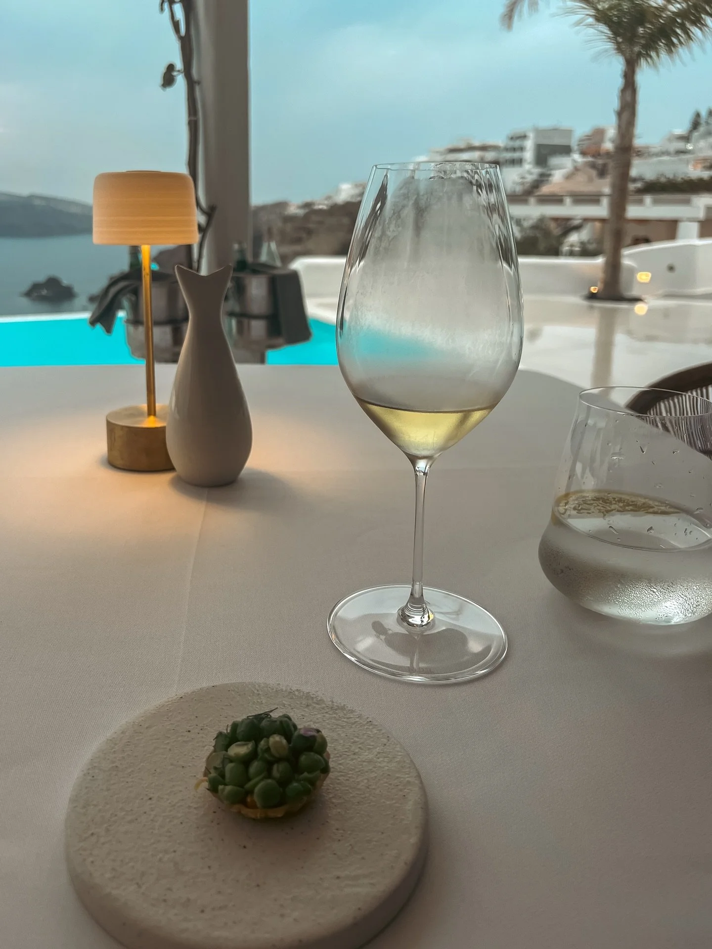 The right restaurant changes solo travel entirely.

My first fine dining experience alone was at Botrini&rsquo;s in Santorini.

I remember walking in feeling slightly aware of myself. The only one at the table. No distraction. No conversation to hide