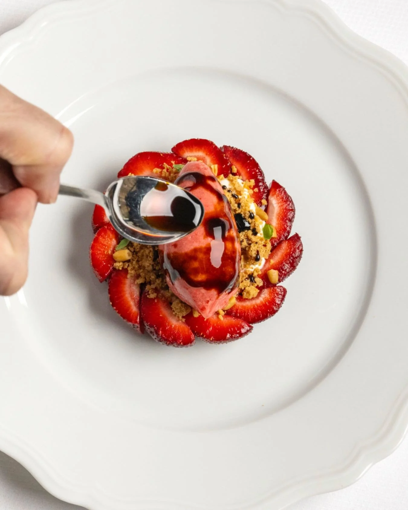 The Strawberry Chartreuse is how summer tastes at Caf&eacute; Carmellini: a strawberry &ldquo;shell&rdquo; with fromage blanc and Chartreuse jam, layered with granola crumble, strawberry sorbet, and a finish of aged balsamic. 

#TheFifthAvenueHotel
#