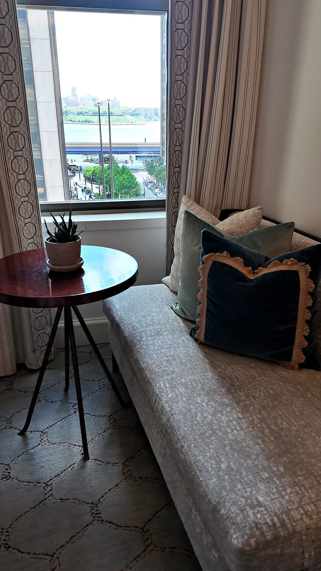 The window seat in a guest room at The Wall Street Hotel, looking out to the river.