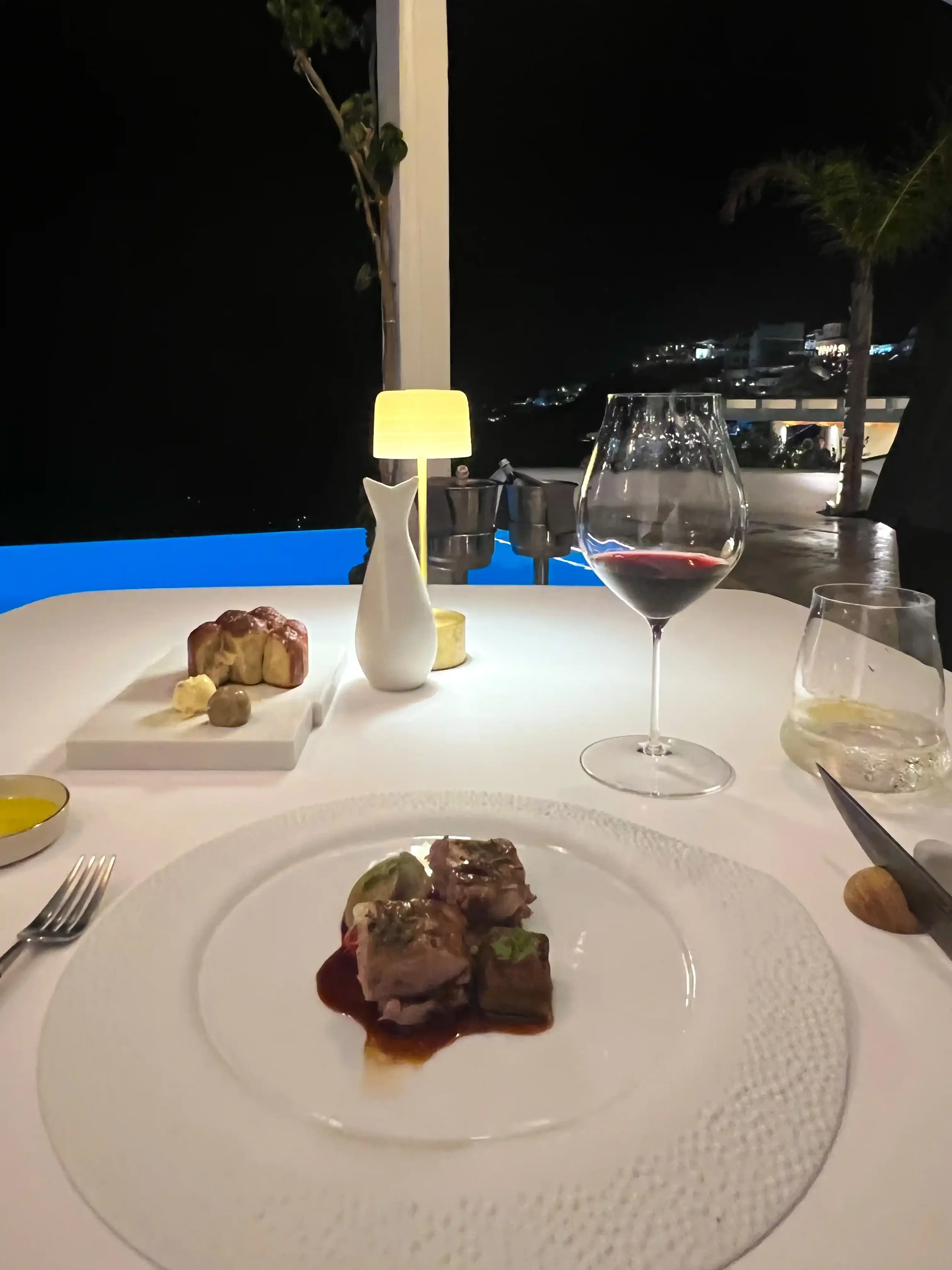 Luxury solo dining at Botrinis Santorini terrace with caldera view