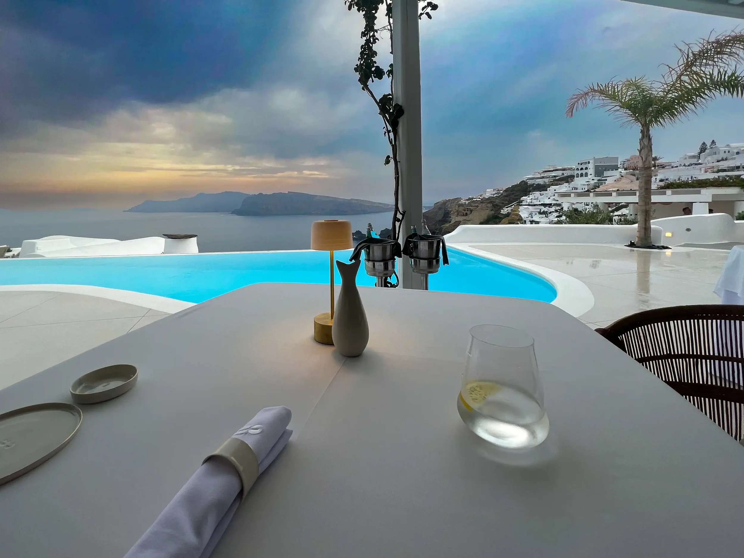 Luxury solo dining at Botrinis Santorini terrace with caldera view