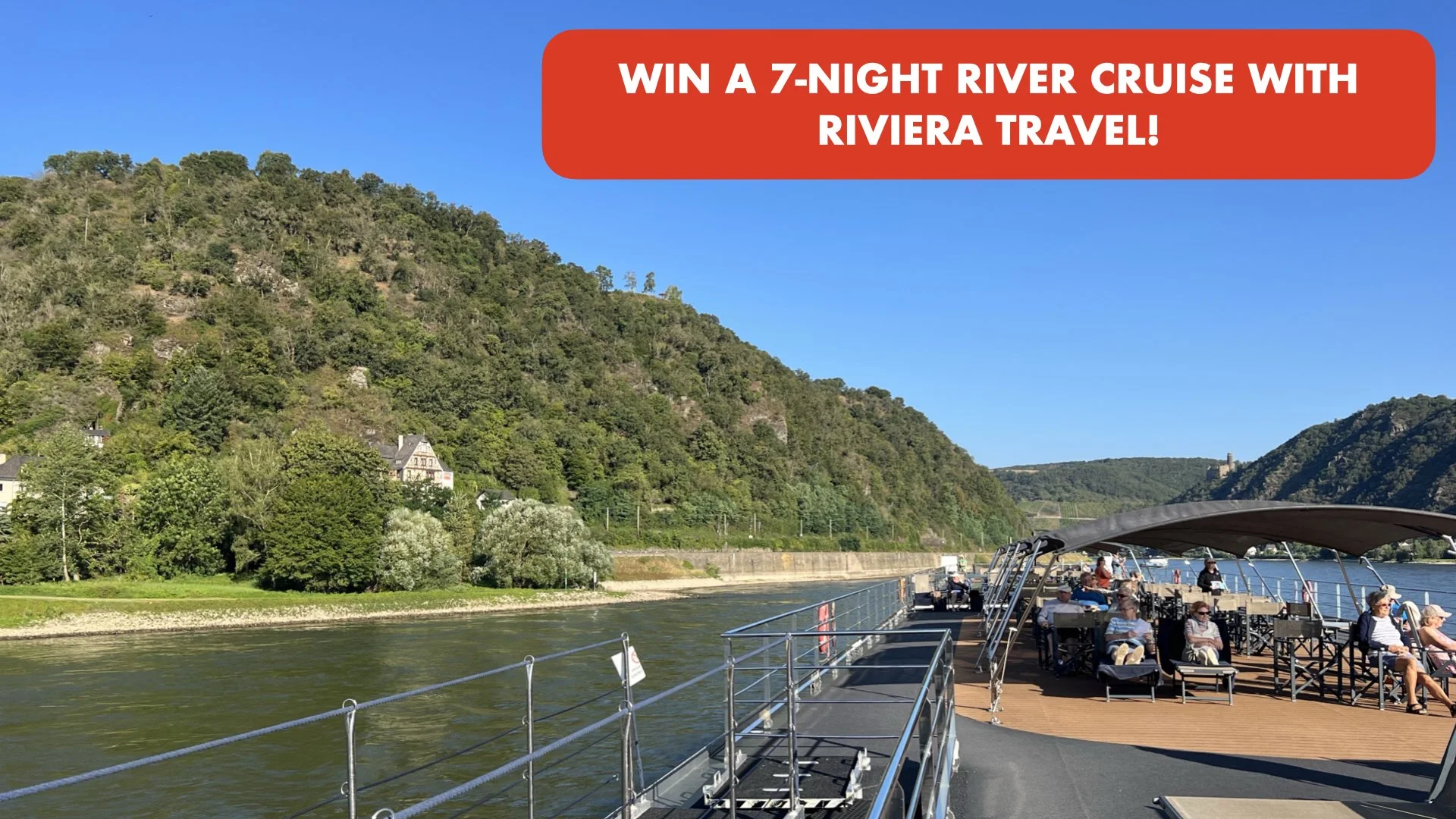 A cruise boat with passengers sitting outside on the deck along a river, surrounded by green hills under a clear blue sky, with a red banner at the top advertising a 7-night river cruise giveaway.