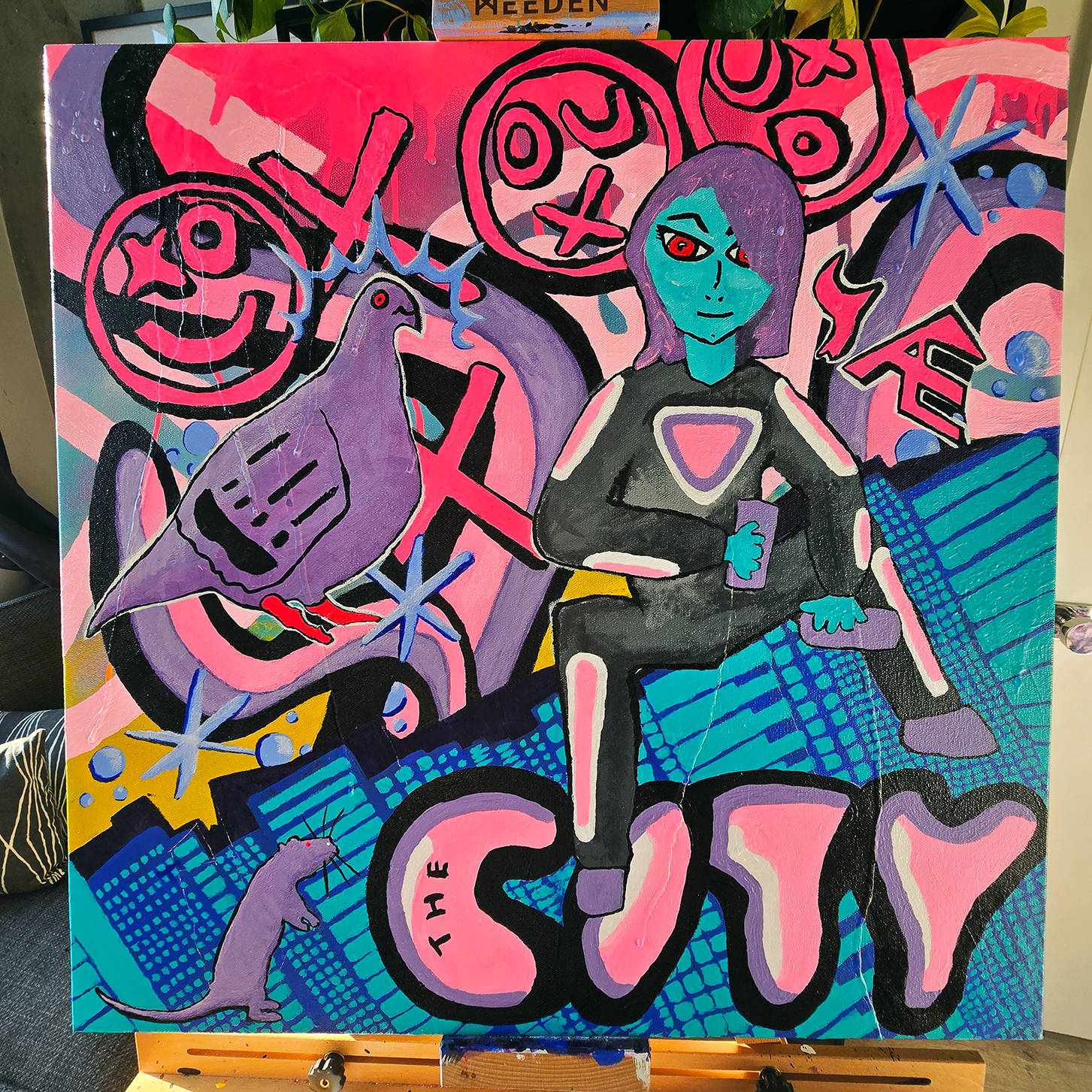 abstract acrylic painting on an easel of a pigeon and women