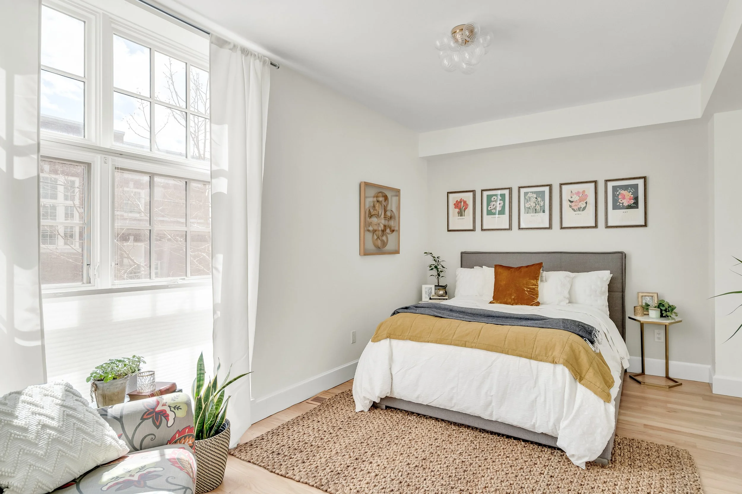 Sanded and refinished the hardwood floors with a water-based finish, replaced the overhead fixture, and added top-down bottom-up blinds to the windows.