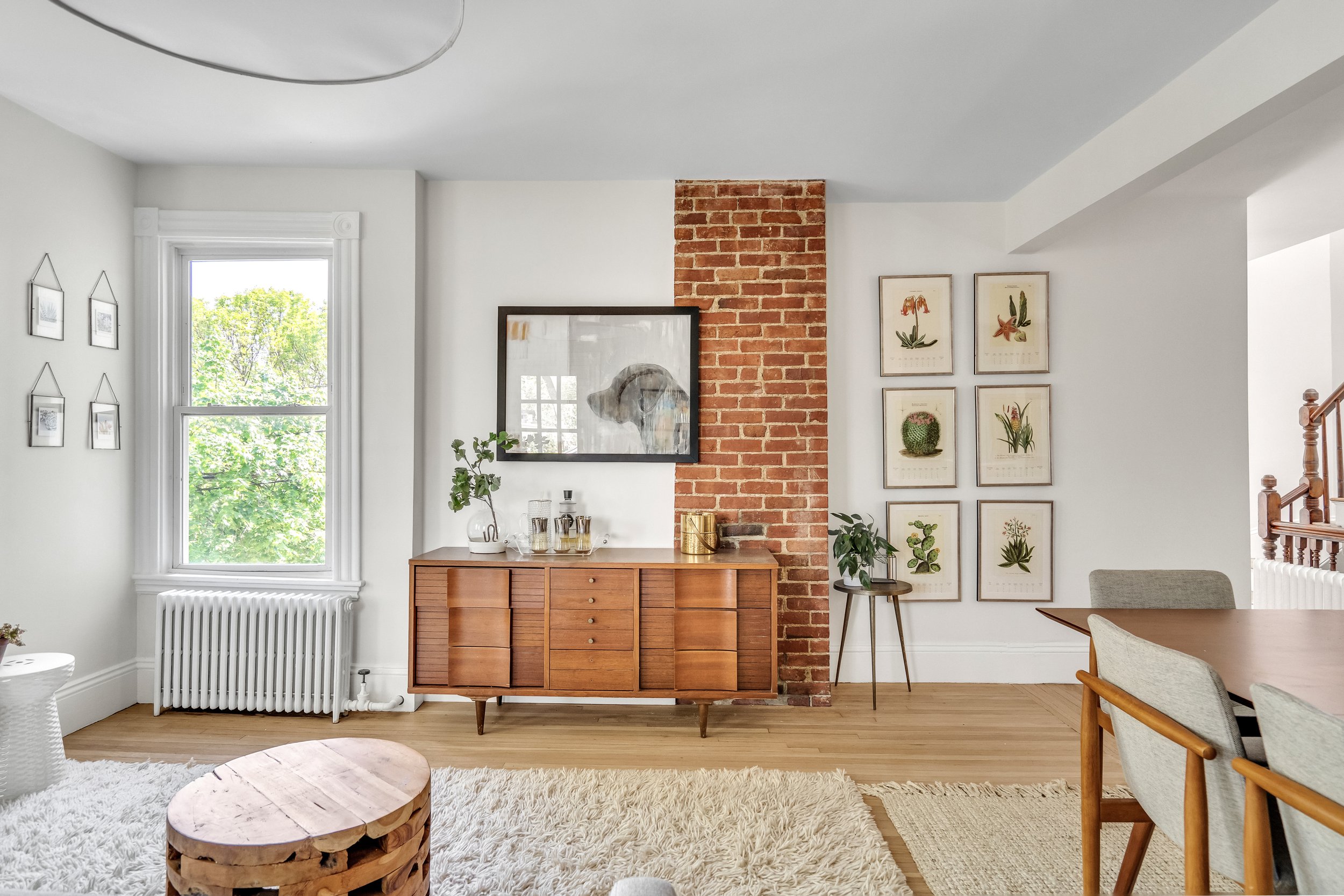 Added a wall to create a bedroom on one side, and a bright, open living/dining area on the other.