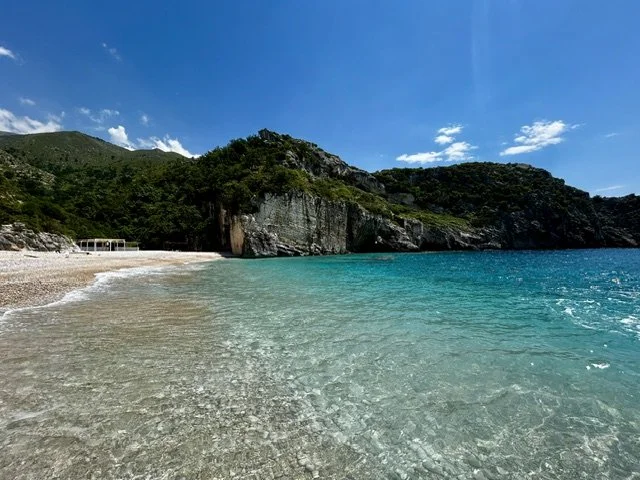 Crystal-clear turquoise water at Grama Bay on the Albanian Riviera