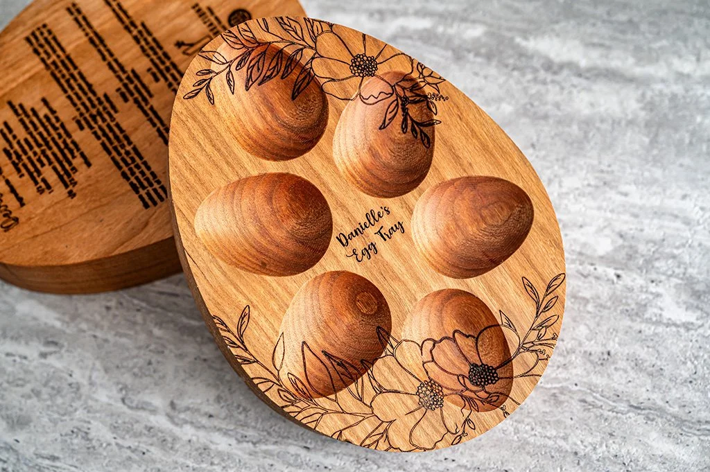 Engraved wooden mini egg tray with floral motif.