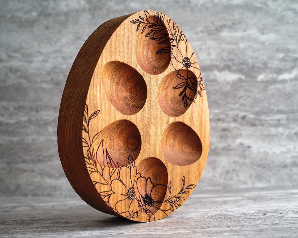 Handcrafted wooden mini egg tray with engraved floral design.