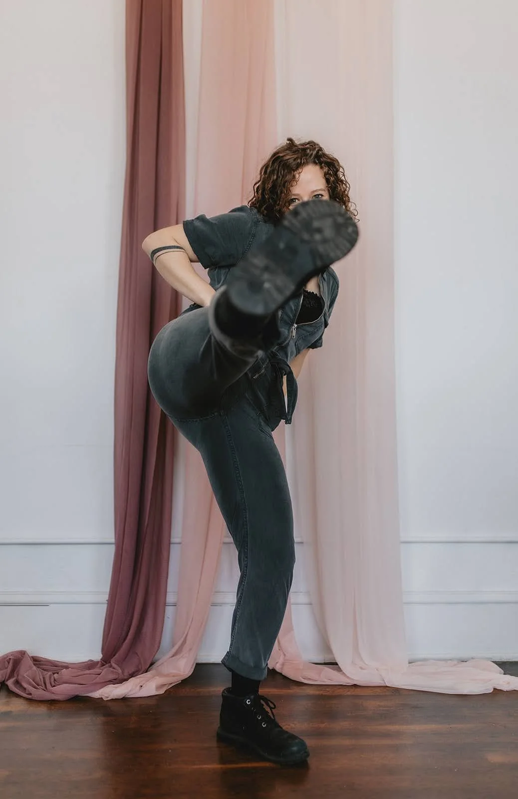 Photo of Savannah kicking her foot at the camera