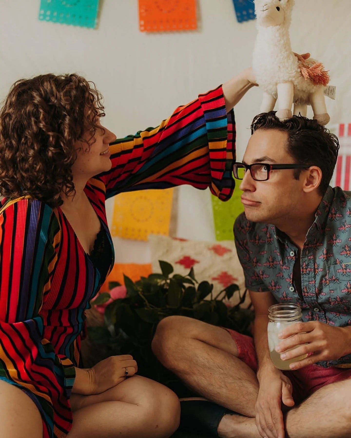 William and Savannah being silly with a lama stuffed animal