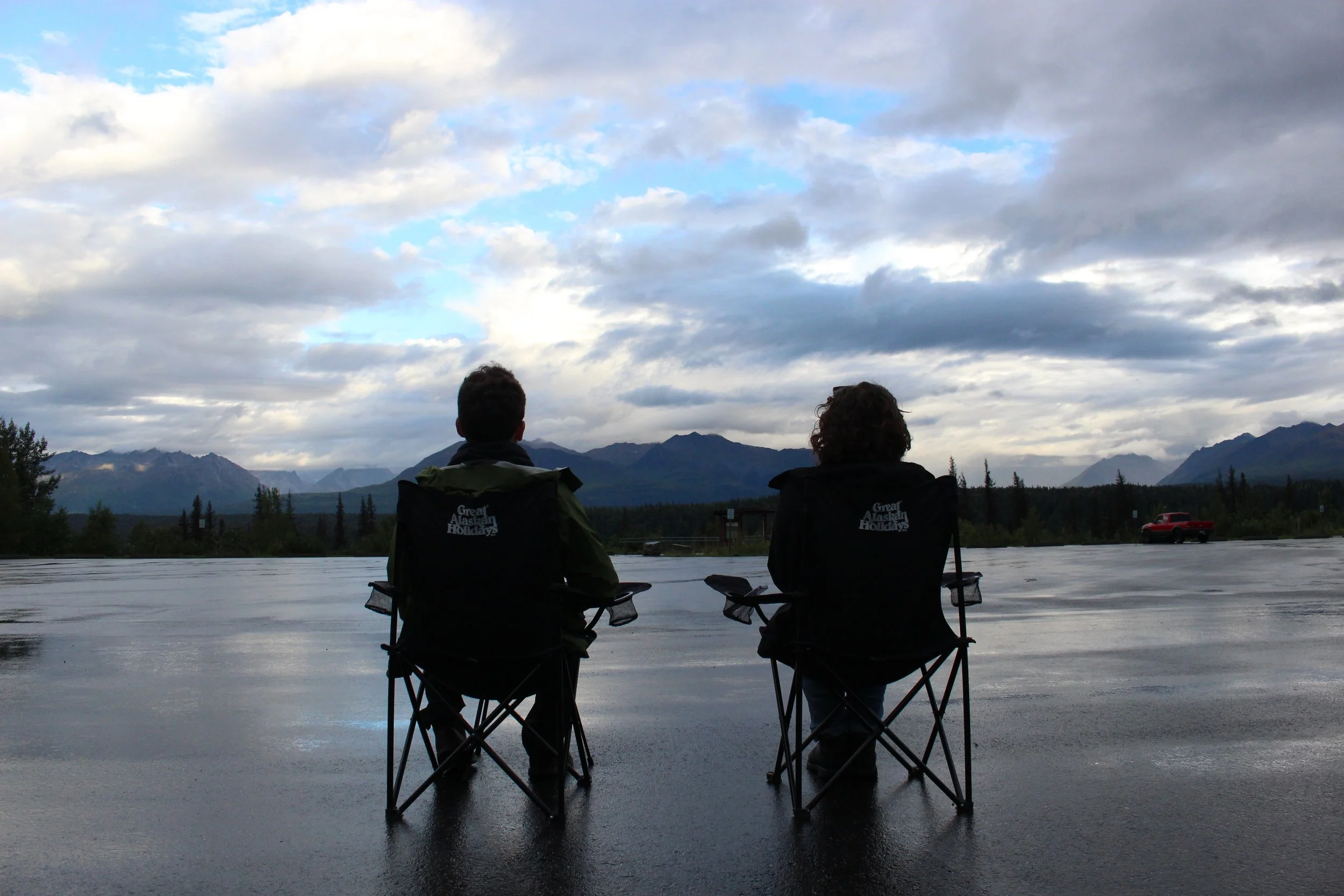 Savannah and William looking out over Alaska's mountain ranges
