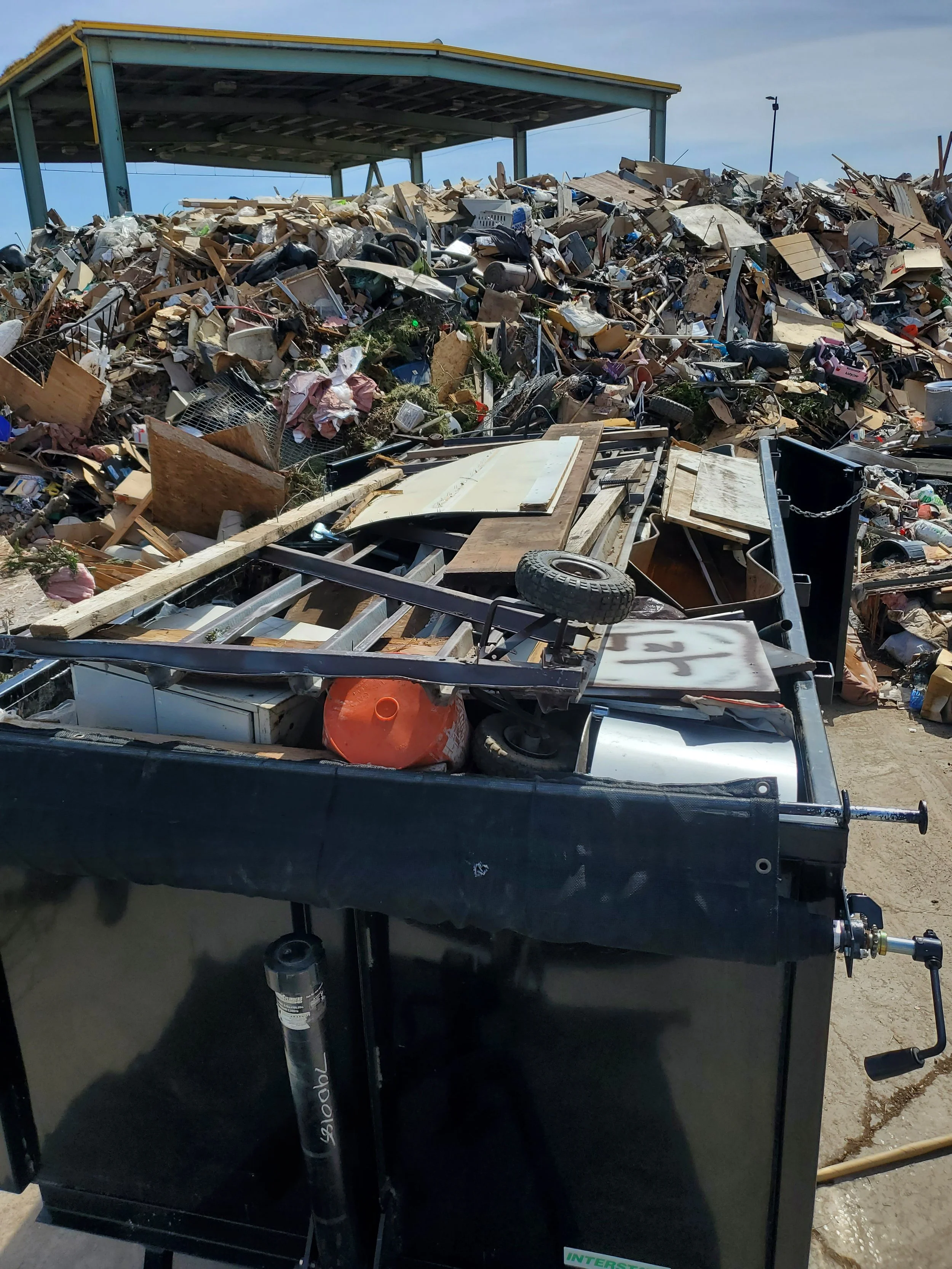 Oranssi technician working on a roof project