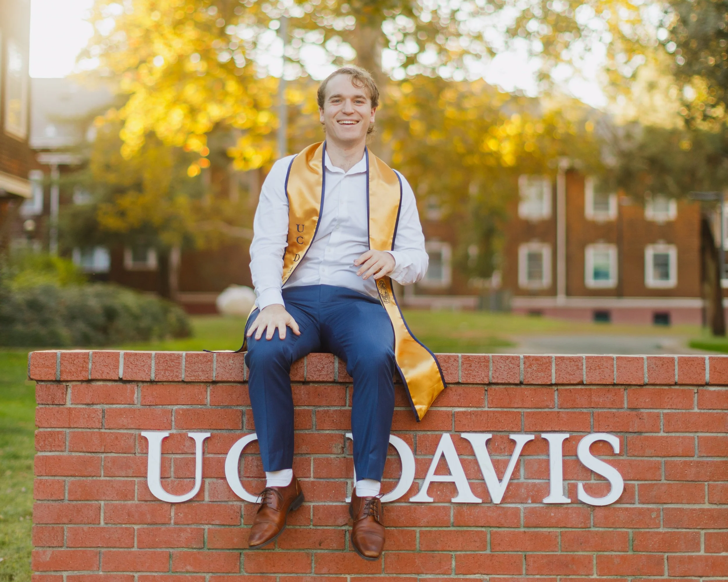Solo grad photo at the UC Davis brick sign.