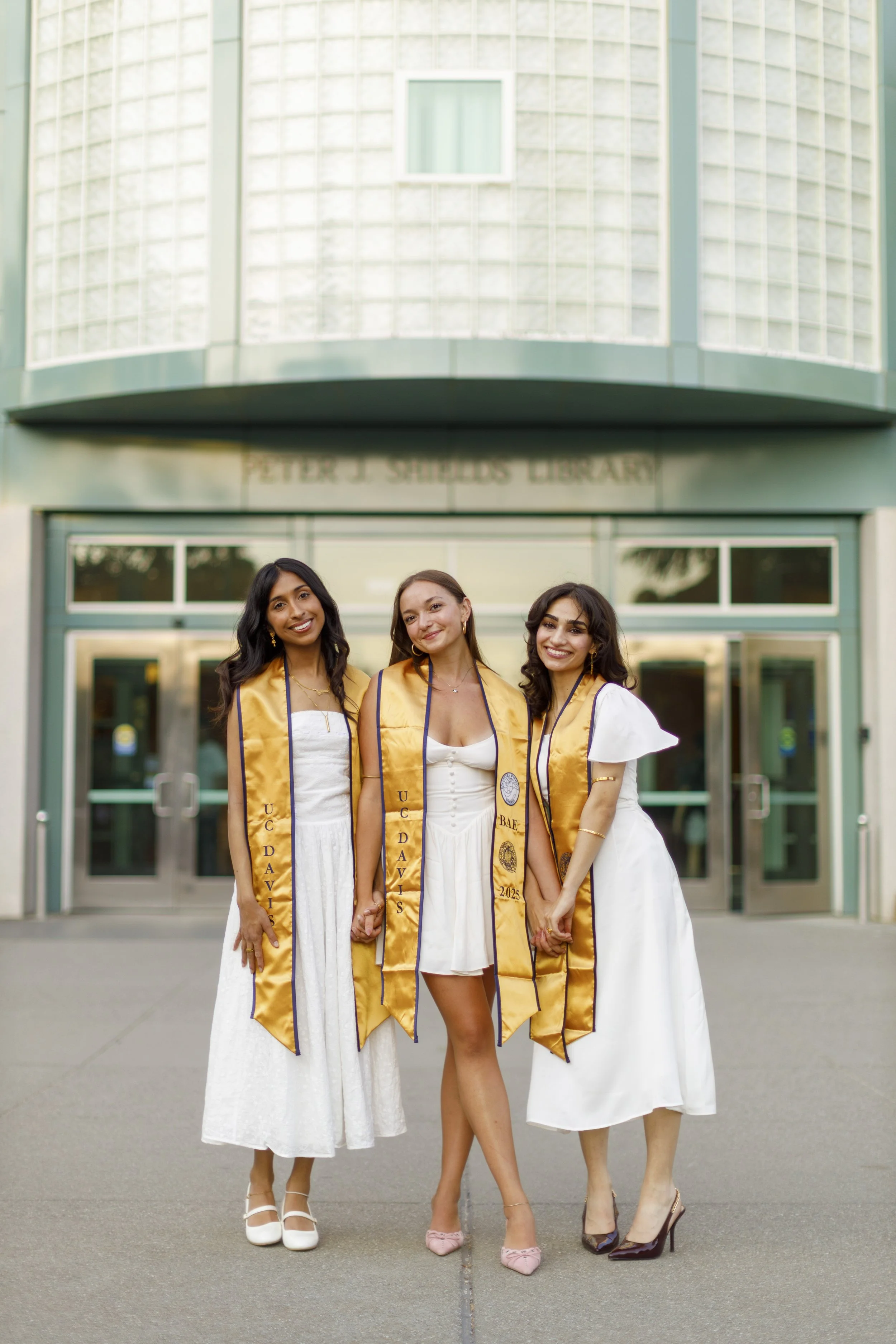 UC Davis group grad photo in front of Shields Library.