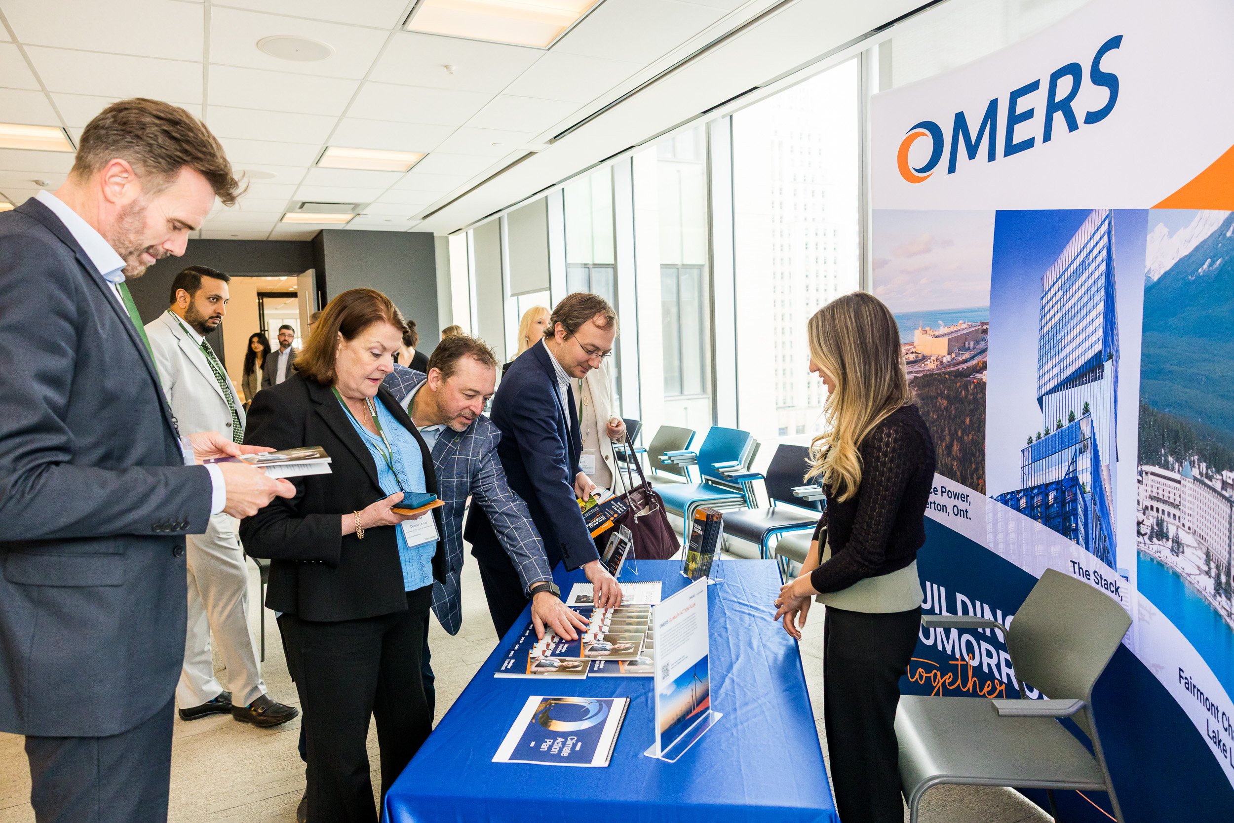 conference-attendees-appraoching-display-table-gathering-literature.jpg