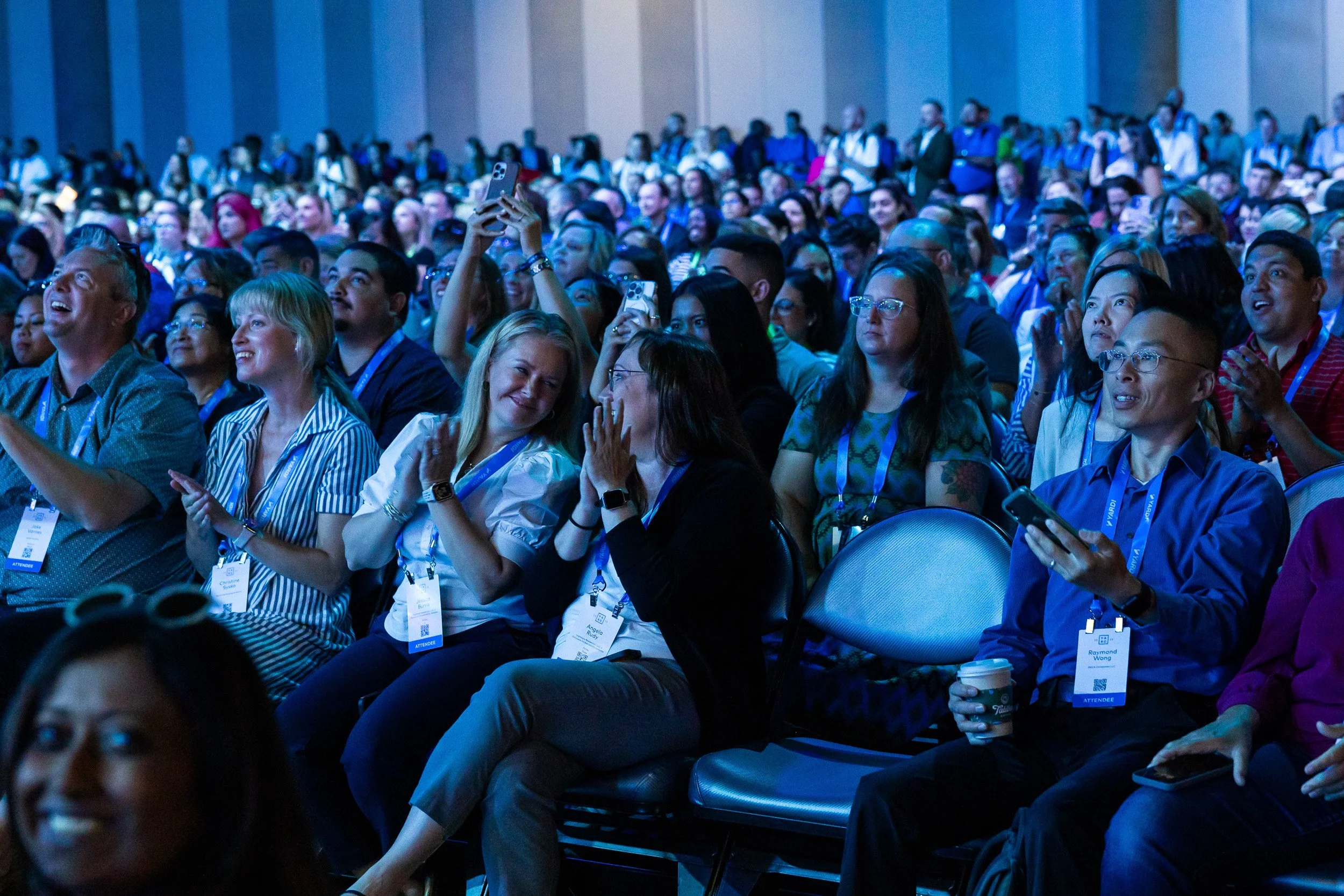 audience-applauding-and-smiling-at-each-other-during-a-keynote-session.jpg