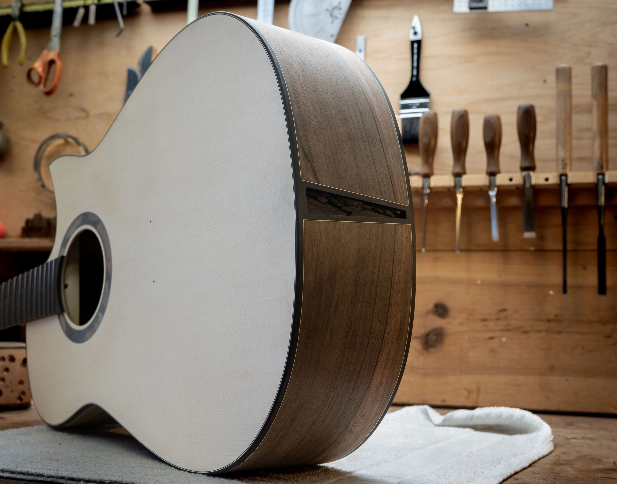 Silverman guitar butt inlay, end wedge, end graft. 3D rock layers, live edge.