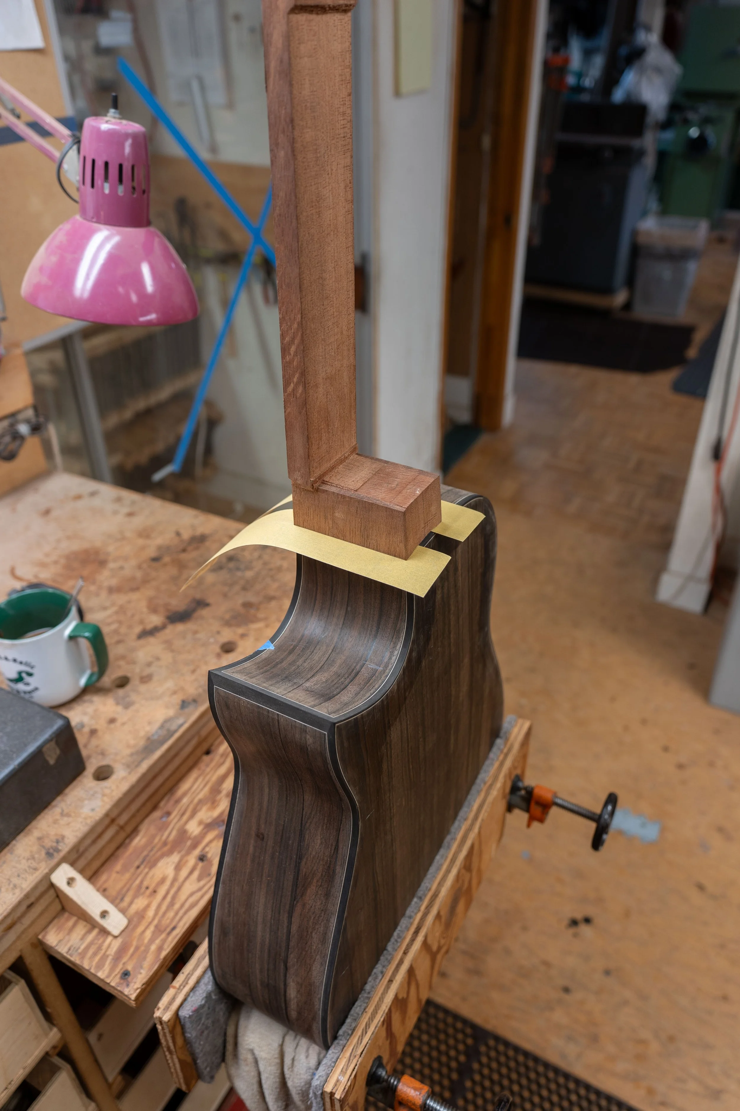 Then fitting the tenon into the mortise and setting the neck. 