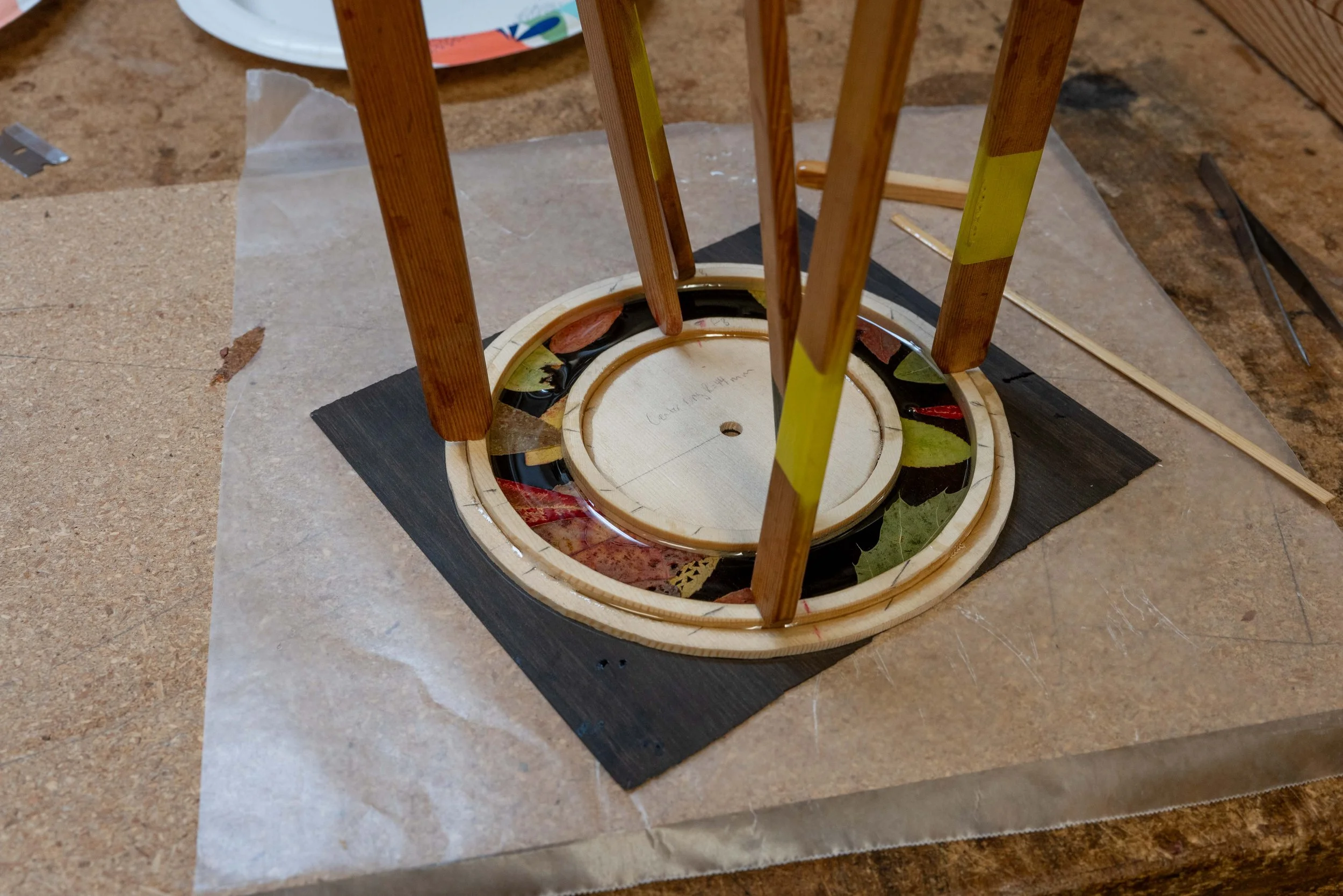 I arranged the leaves over ebony in a way I found pleasing, and added some resin to make the rosette. 