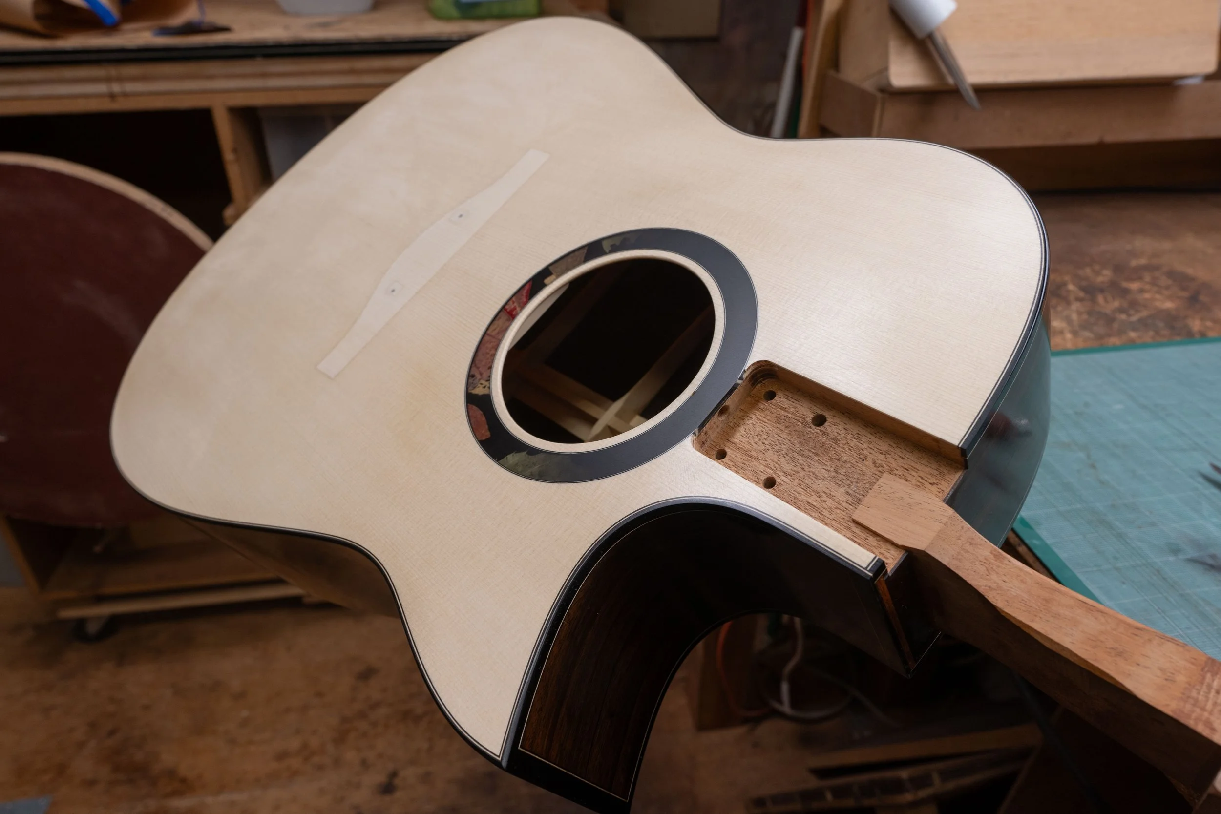 Silverman guitar rosette with leaves and sprayed gradient.