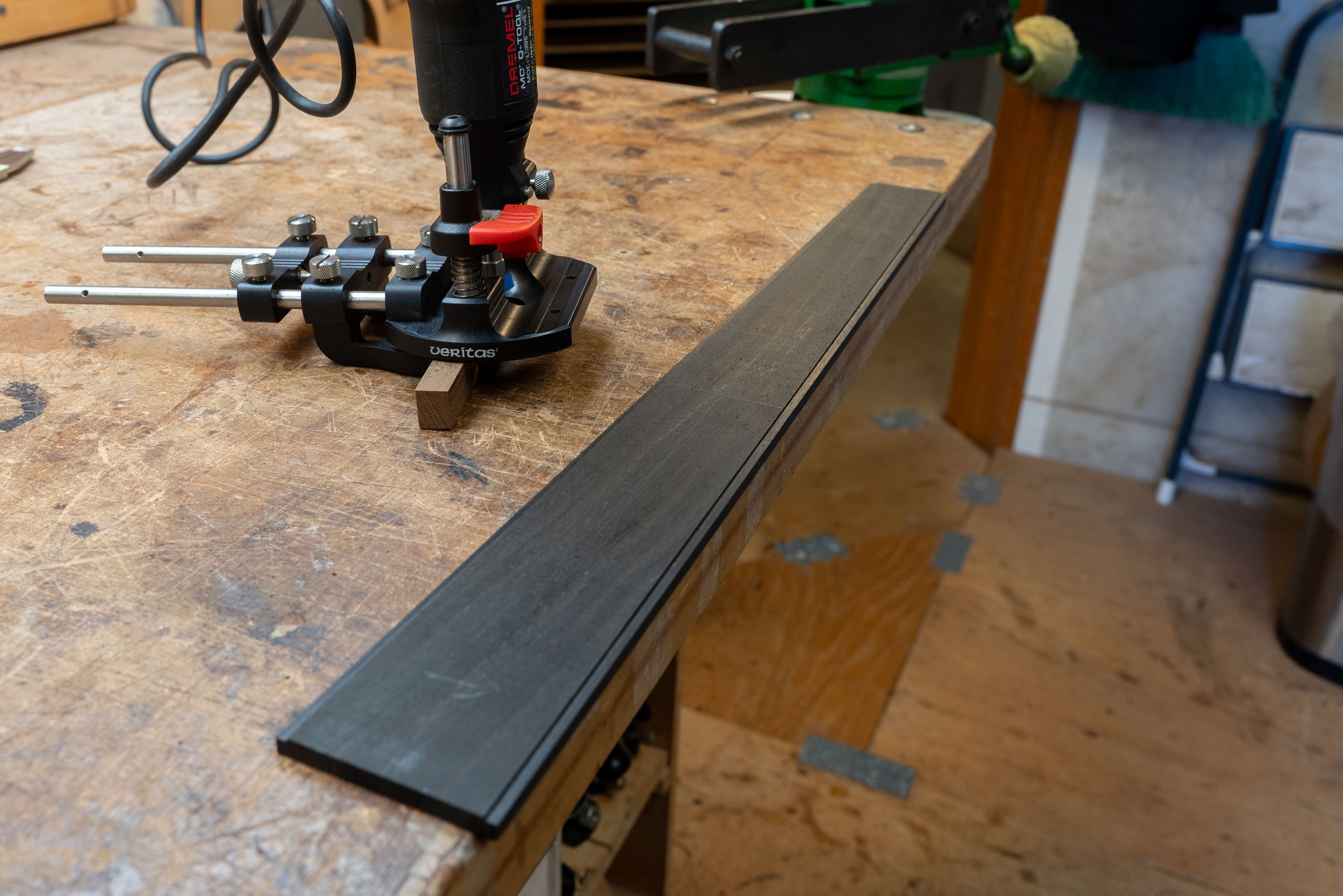 I wanted to integrate the side fret markers into the bottom of fretboard purfling. My process for doing this was to inlay into the bottom of the fretboard. I first cut a channel for the purfling. 