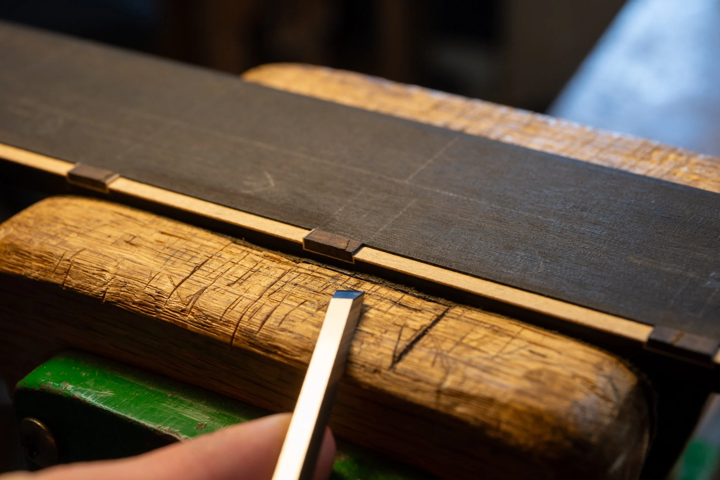 And trimmed the white purfling around the rectangle down to the level of the white fretboard purfling. 