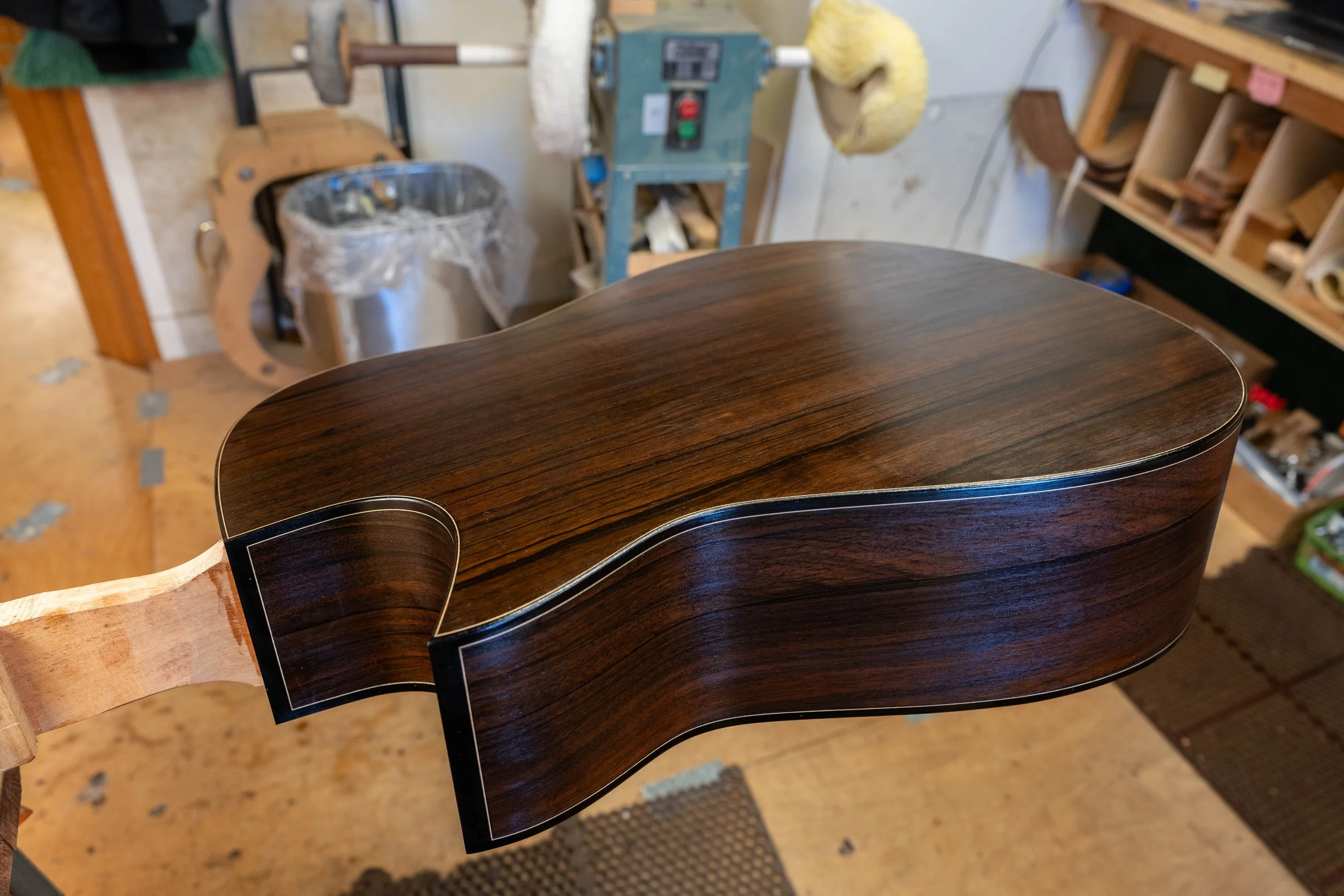 Malaysian Blackwood back and sides on a Silverman guitar. Pore filling with epoxy.