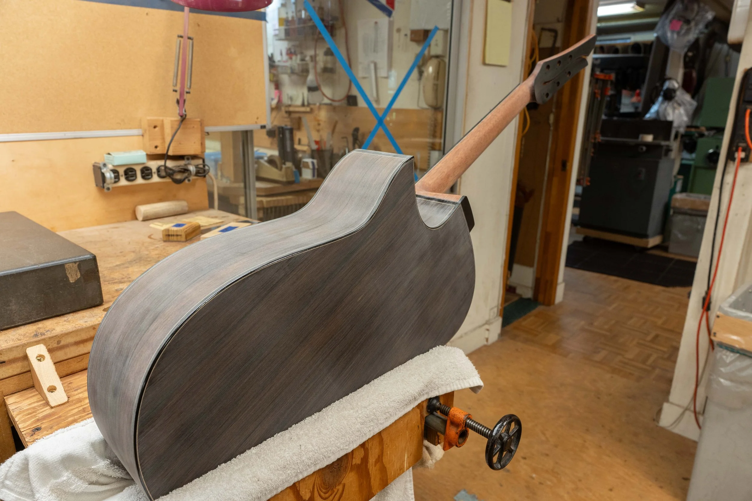 Epoxy pore filling. Silverman guitar.