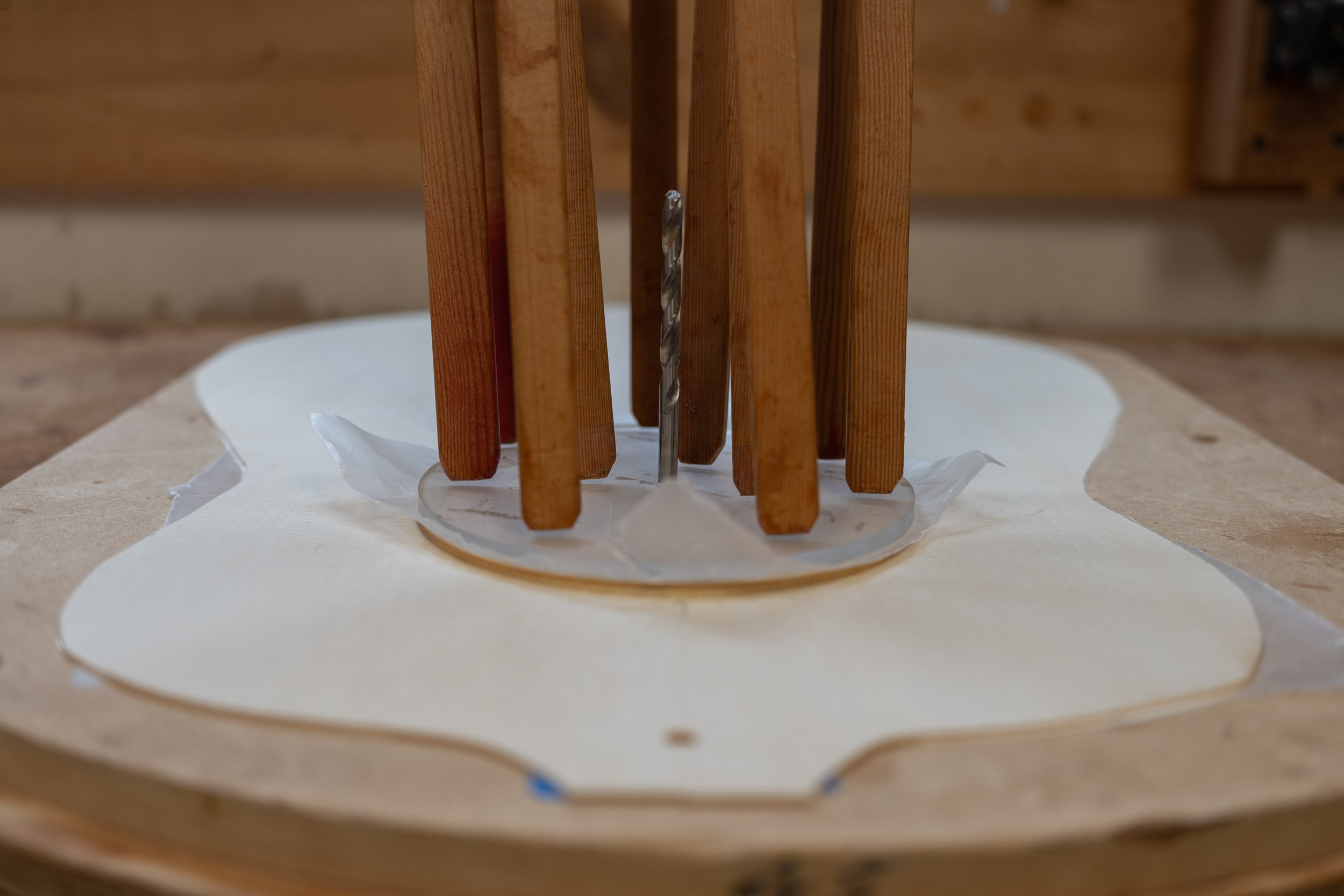 The rosette is thicker than the top, so I had to glue the soundhole reinforcing donut before I could inlay it. 