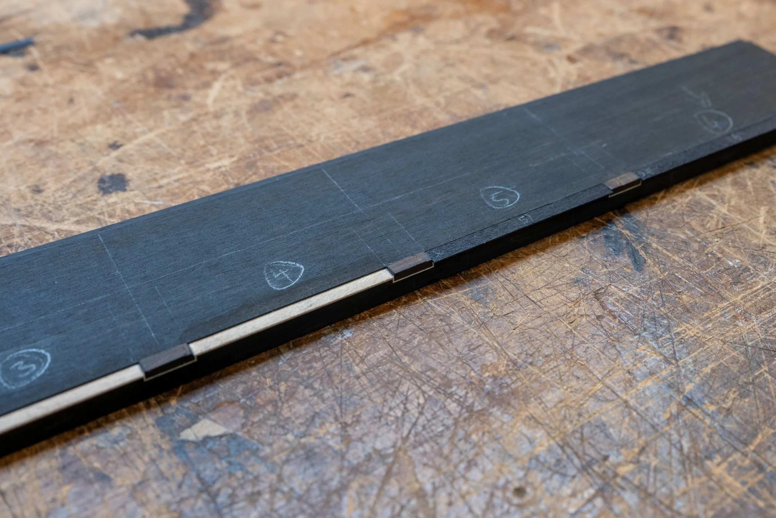 Then I fit and glued black purfling in between. 