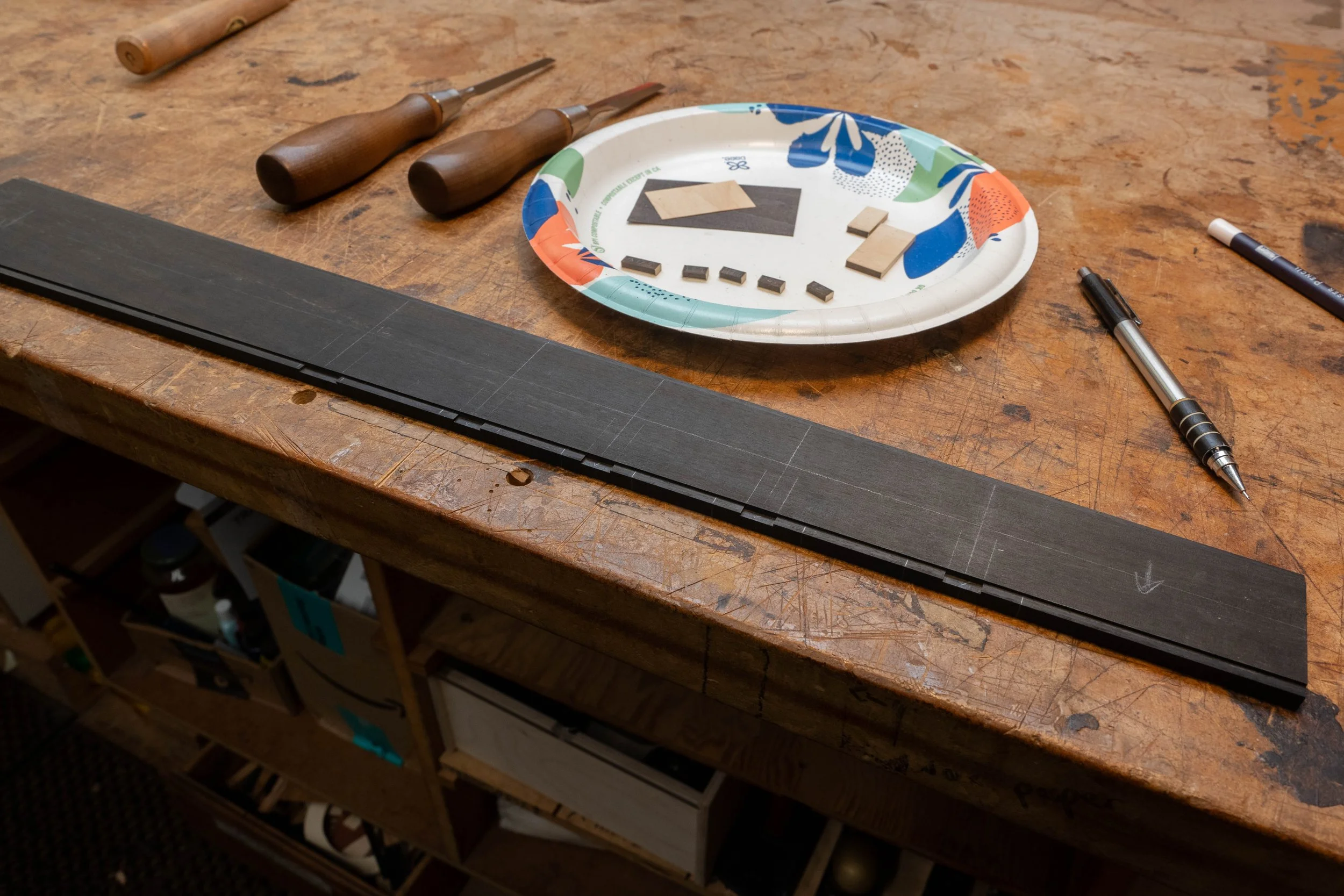 I then cut some notches in the centre of the frets to be marked. 