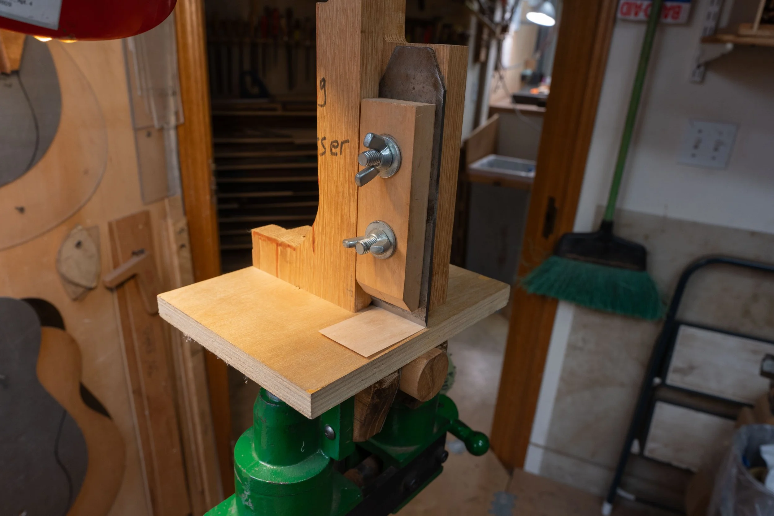 I made a piece of purfling thinner by pulling it under the blade of this jig.