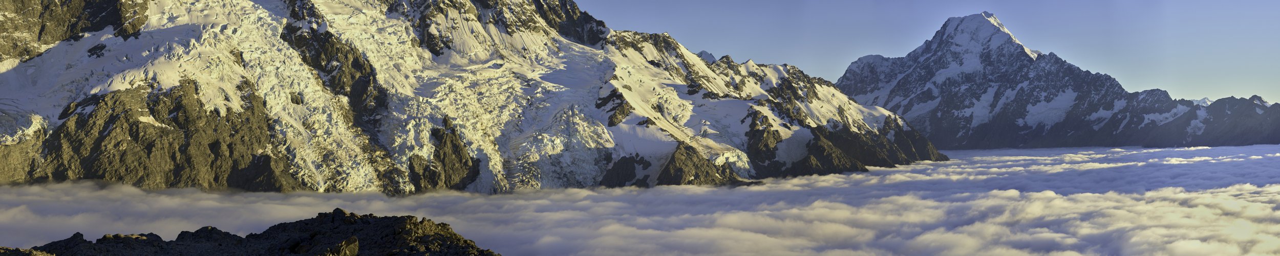 Dawn above low clouds