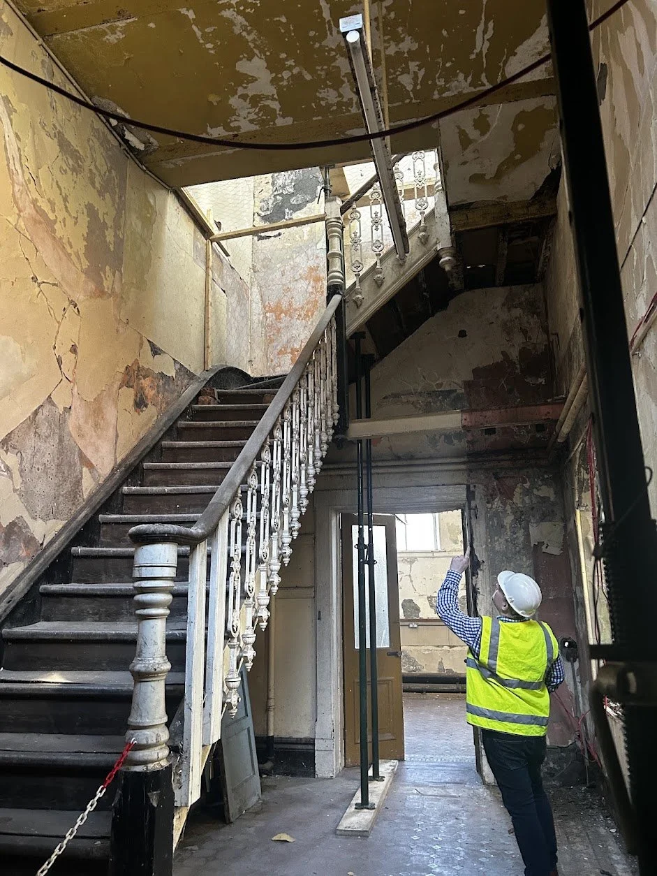 A historic staircase in a vacant heritage building